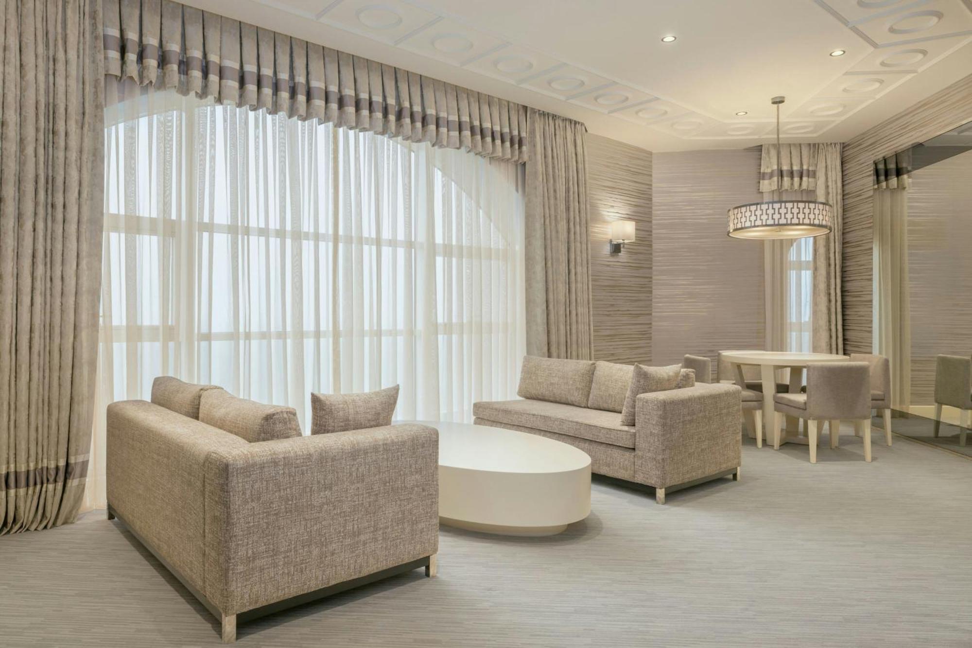 Sheraton Batumi Hotel Bagian luar foto A living room with a large window